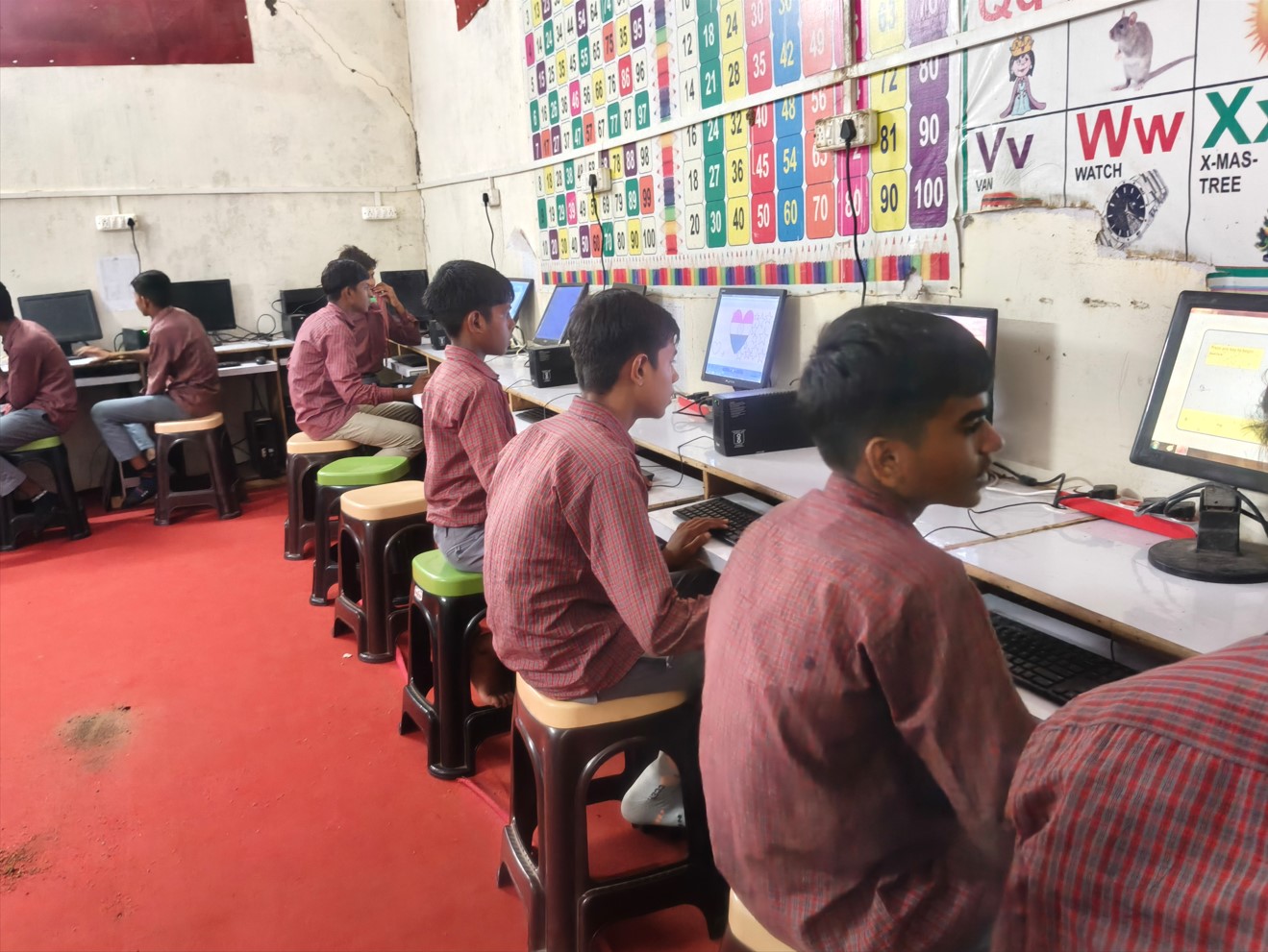 Students learning in the school computer lab